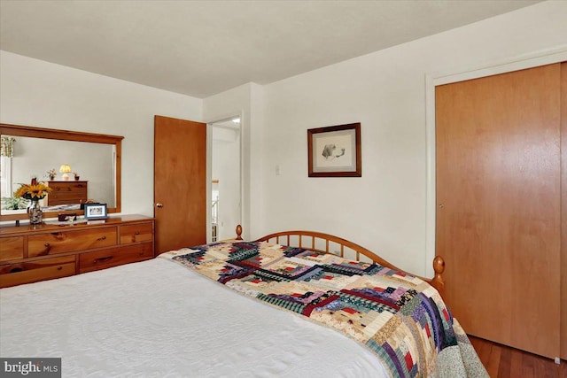 bedroom with wood finished floors