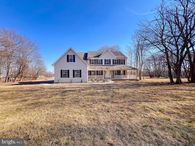 view of front of house with a porch and a front lawn