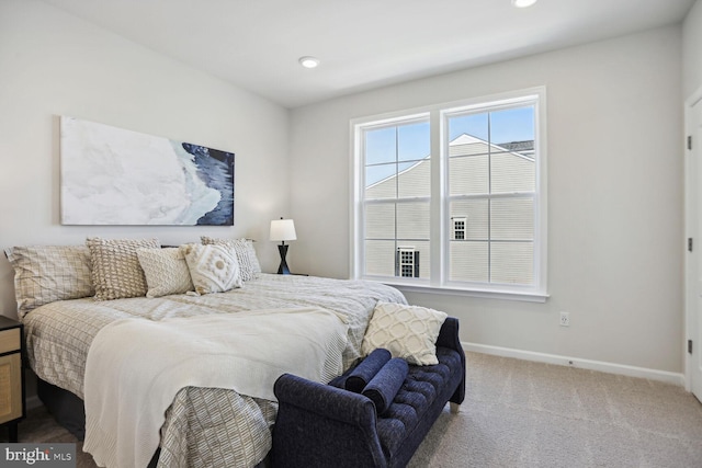 carpeted bedroom featuring recessed lighting and baseboards