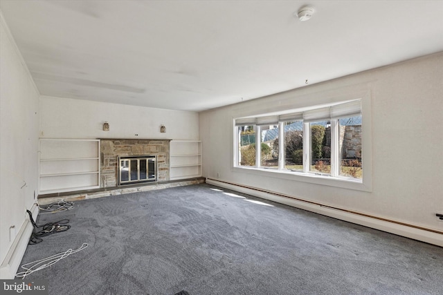 unfurnished living room with carpet flooring, a fireplace, and a baseboard radiator