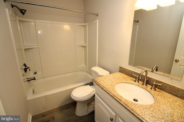 bathroom featuring shower / bath combination, toilet, wood finished floors, and vanity