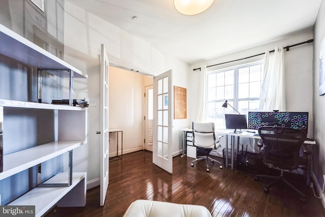 office featuring hardwood / wood-style floors, french doors, and baseboards