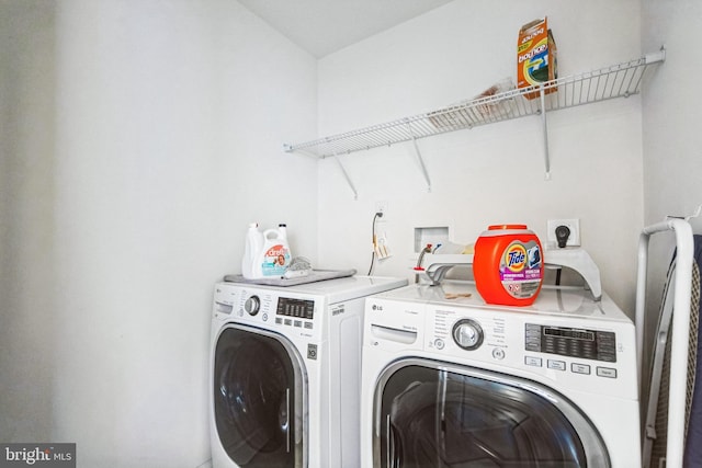 washroom with laundry area and washing machine and clothes dryer