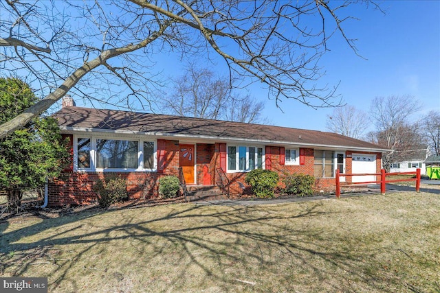 ranch-style home with a front lawn, a garage, brick siding, and a chimney