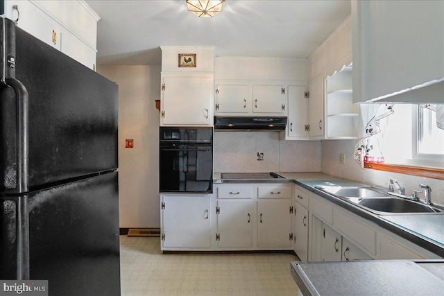 kitchen featuring black appliances, under cabinet range hood, open shelves, a sink, and light floors