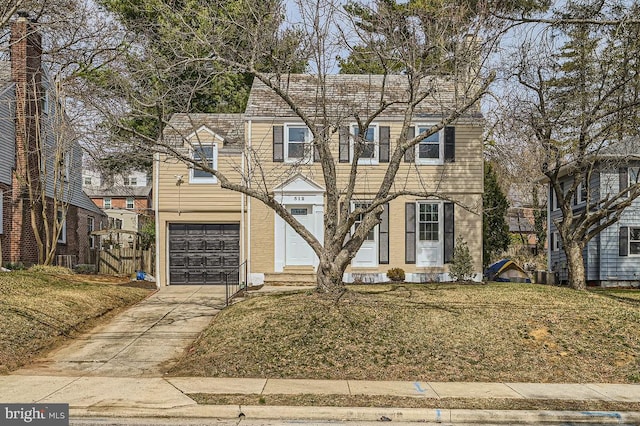 view of front facade with a garage, brick siding, and concrete driveway