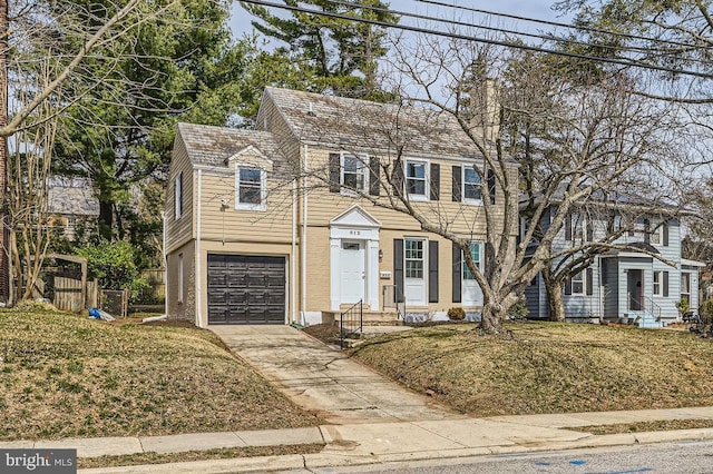 view of front of home with driveway, entry steps, fence, a garage, and a chimney