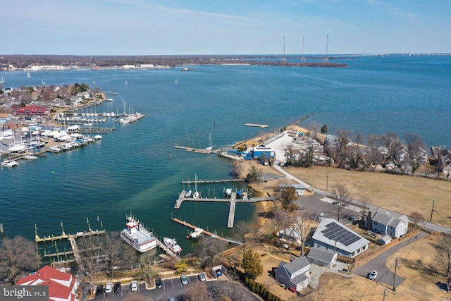 birds eye view of property with a water view