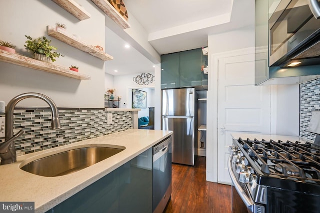 kitchen with dark wood finished floors, open shelves, a sink, appliances with stainless steel finishes, and backsplash