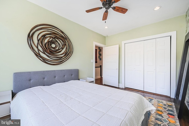 bedroom with recessed lighting, a closet, wood finished floors, and a ceiling fan