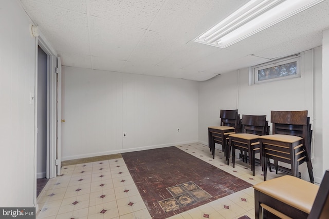 interior space with tile patterned floors and baseboards