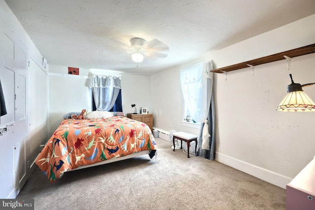 bedroom featuring baseboards and carpet floors