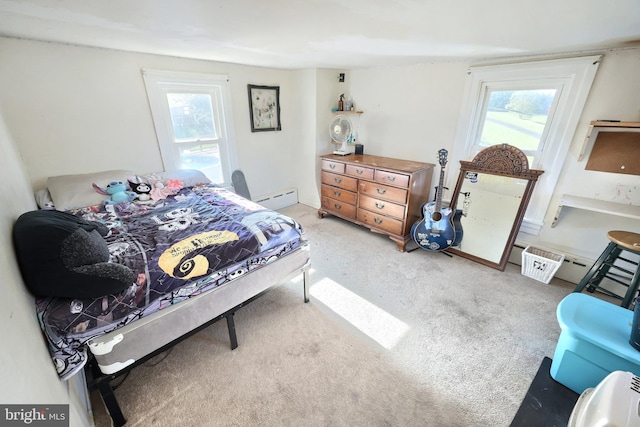 bedroom with baseboard heating and carpet flooring