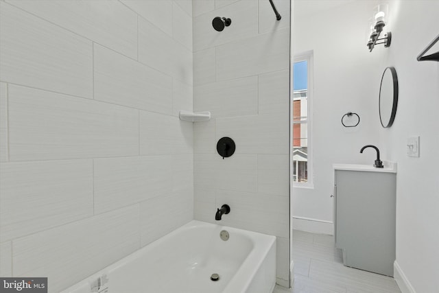 full bath featuring shower / washtub combination, vanity, and baseboards