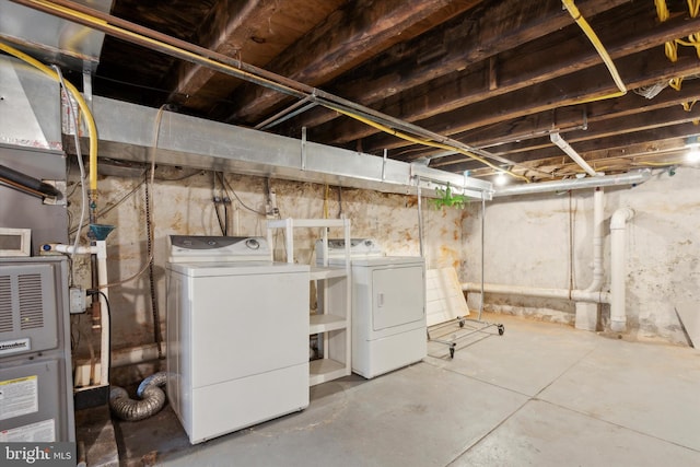 unfinished basement featuring washer and clothes dryer