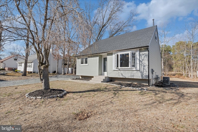 view of front of house with entry steps and a shingled roof