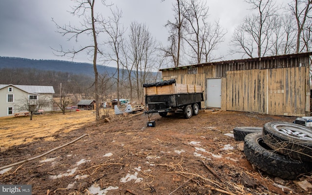 view of yard featuring an outbuilding and an outdoor structure