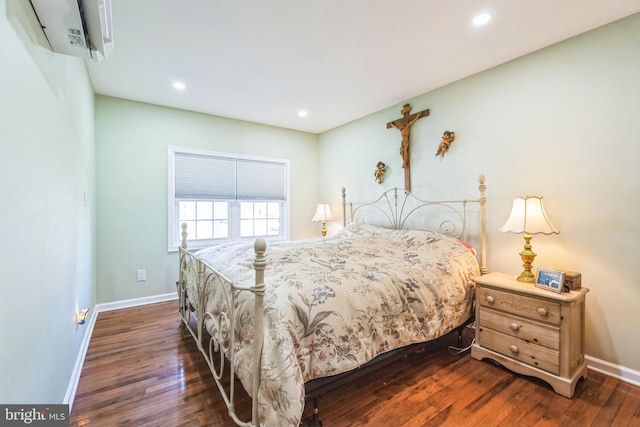 bedroom with recessed lighting, baseboards, and dark wood finished floors