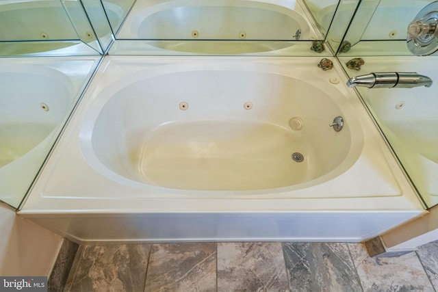 bathroom with a whirlpool tub