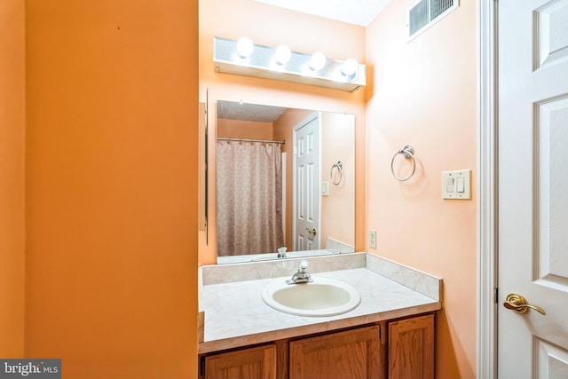 full bath with vanity and visible vents