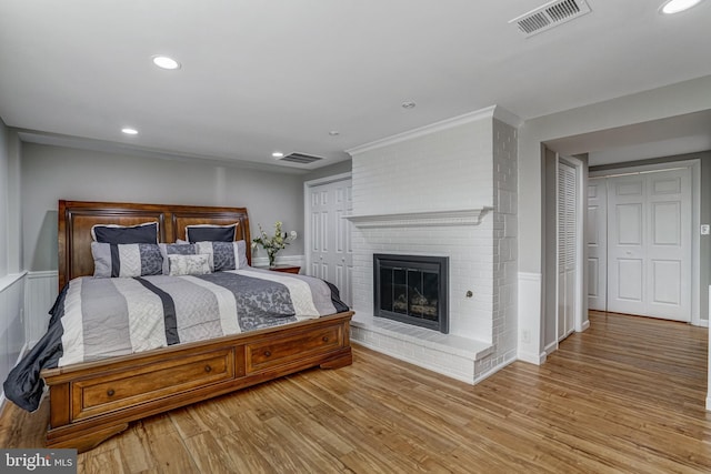 bedroom featuring visible vents, recessed lighting, and light wood-style floors