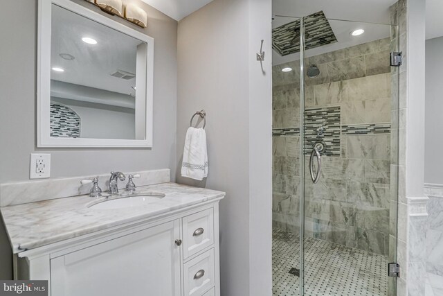 bathroom with visible vents, recessed lighting, a stall shower, and vanity