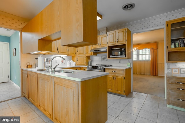 kitchen featuring under cabinet range hood, built in microwave, stainless steel electric range oven, and wallpapered walls