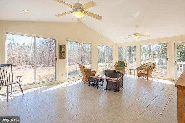 sunroom featuring plenty of natural light, ceiling fan, and vaulted ceiling