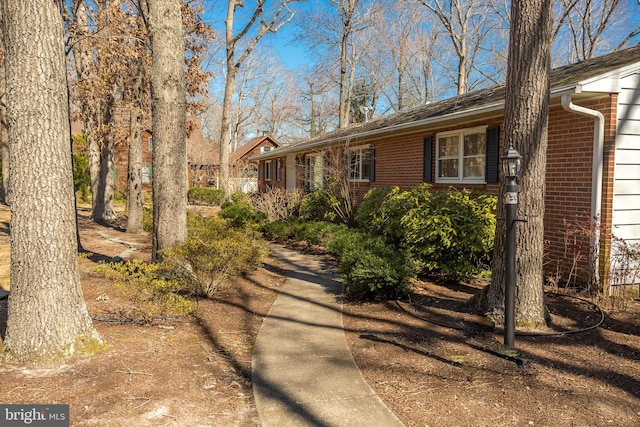 view of front of home featuring brick siding