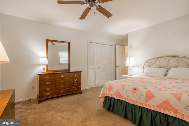 bedroom featuring light carpet, baseboards, a closet, and a ceiling fan