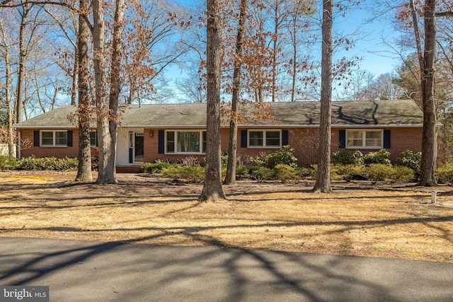 ranch-style house with brick siding