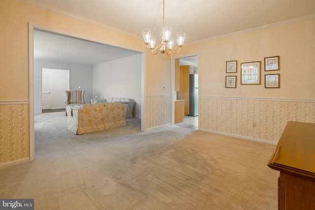 unfurnished dining area with a wainscoted wall, carpet flooring, and wallpapered walls