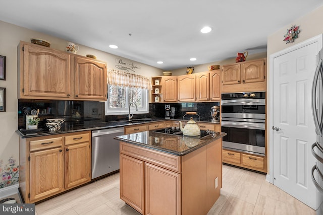 kitchen with tasteful backsplash, a center island, dark stone countertops, appliances with stainless steel finishes, and a sink