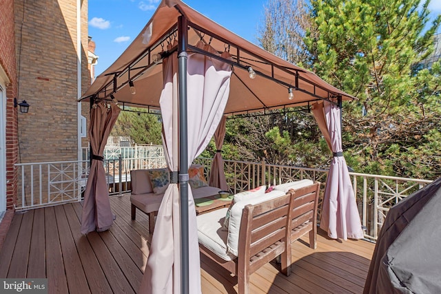 deck featuring a gazebo and an outdoor hangout area