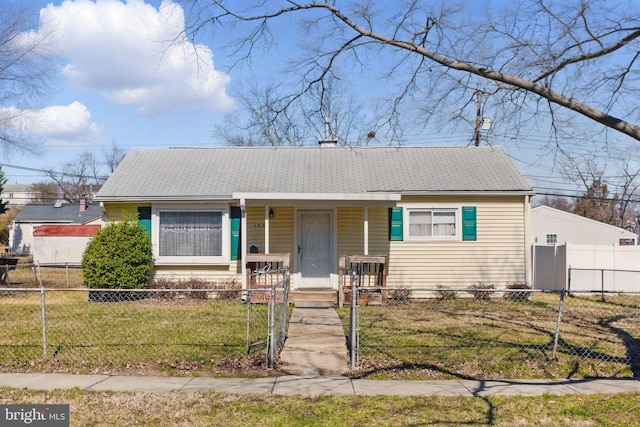 view of front of home with a fenced front yard, a porch, a front yard, and a gate