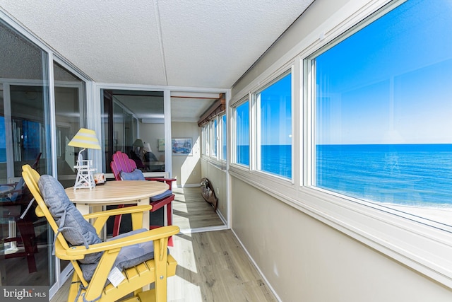 sunroom with a water view