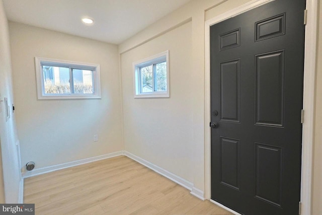 interior space with recessed lighting, baseboards, and light wood-style floors