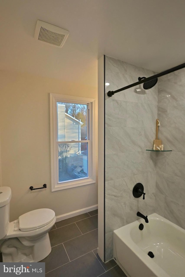 full bathroom with tile patterned floors, visible vents, toilet, and washtub / shower combination