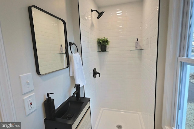 bathroom featuring vanity and a shower stall