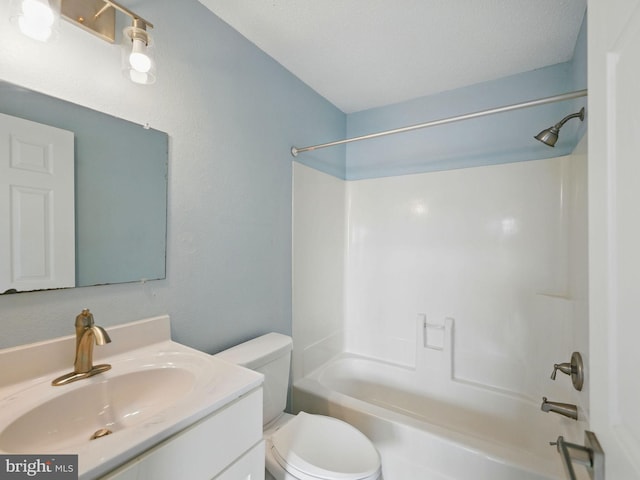 full bathroom with shower / bathing tub combination, toilet, and vanity