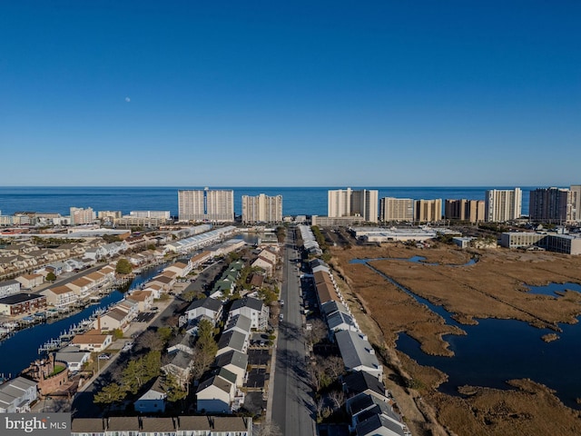 drone / aerial view with a water view and a city view