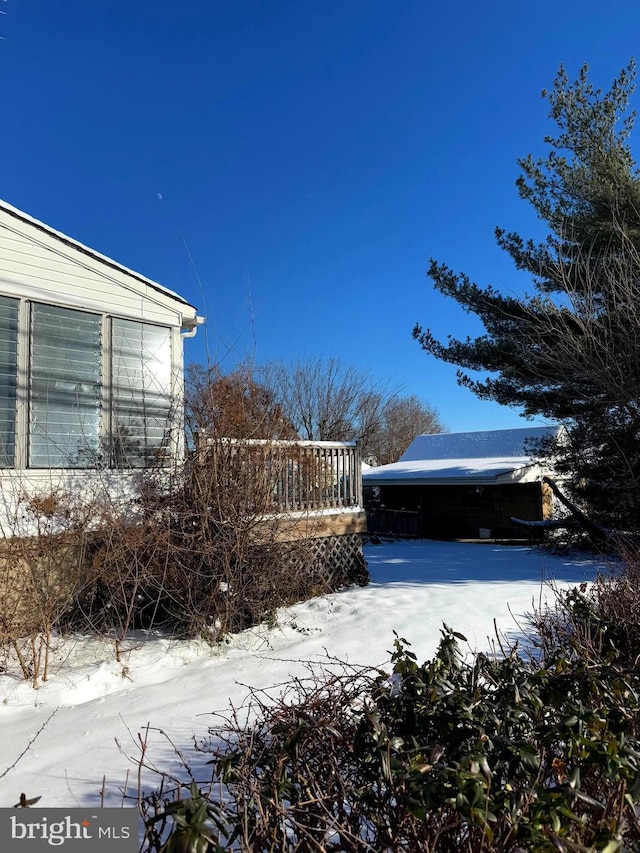 view of yard covered in snow