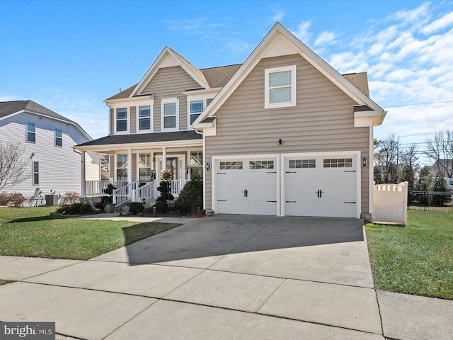 view of front of house with a porch, an attached garage, a front yard, and concrete driveway