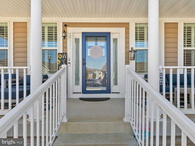 doorway to property with covered porch