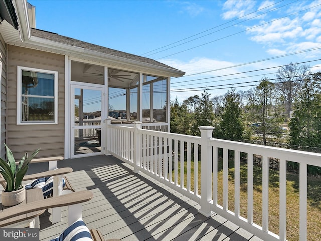 wooden deck featuring a sunroom