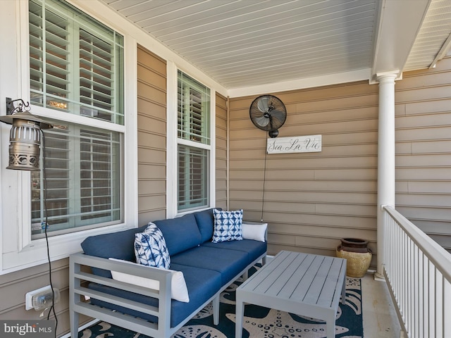 view of patio with an outdoor living space and a porch