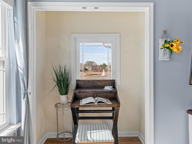 interior space featuring baseboards