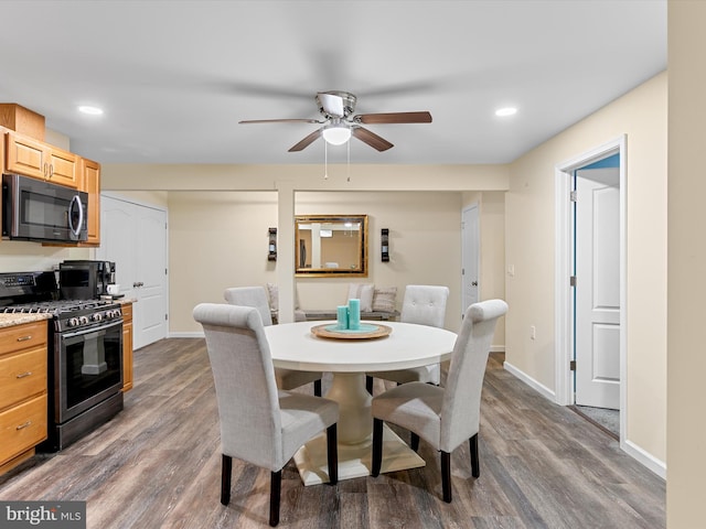 dining space with recessed lighting, a ceiling fan, dark wood-type flooring, and baseboards