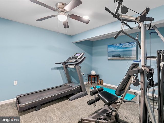 exercise area featuring carpet flooring, baseboards, and ceiling fan