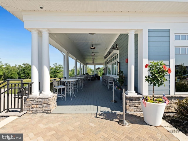 view of patio / terrace with outdoor dining space and covered porch